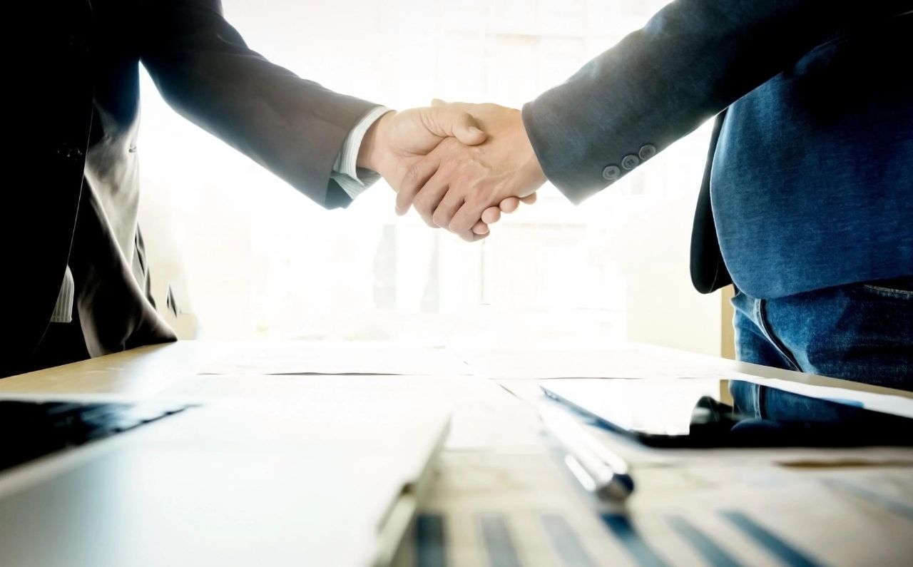 Professional business handshake representing successful exit planning deal