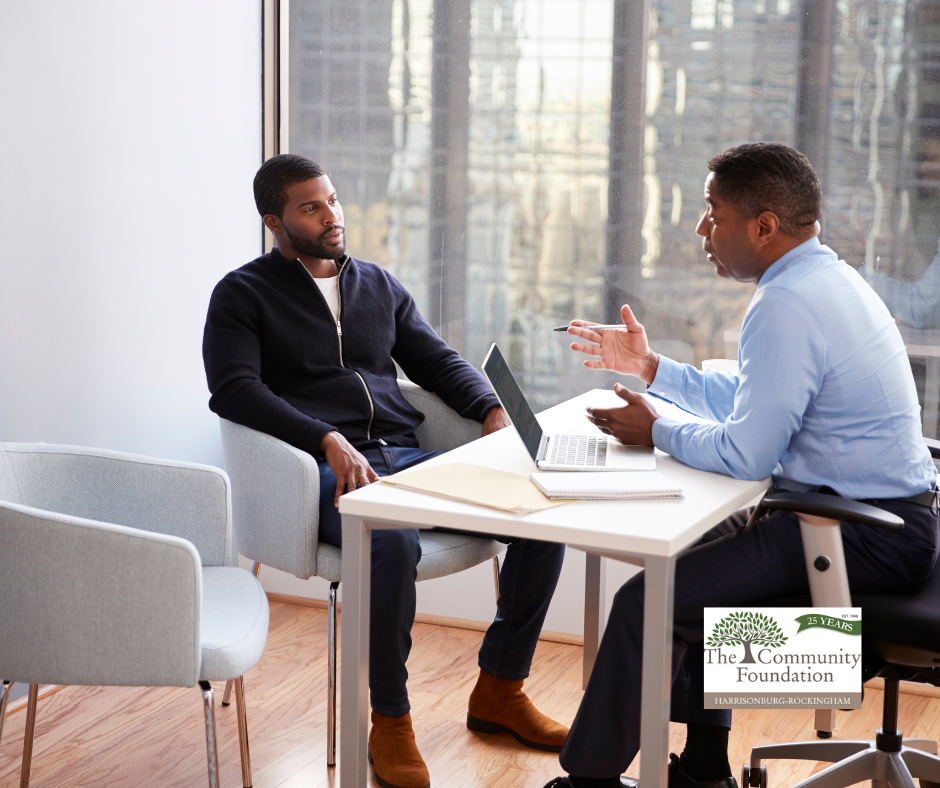 Professional philanthropy planning meeting with advisors to discuss strategic charitable giving